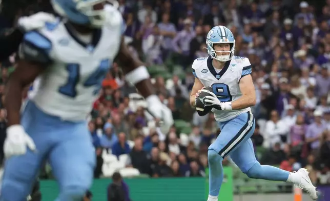 North Carolina quarterback Billy Edwards Jr. looks to pass during an NCAA college football game against TCU in Dublin, Ireland, Saturday, Aug. 29, 2026. (AP Photo/Peter Morrison)