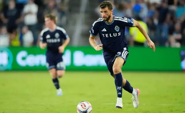 Vancouver Whitecaps' Thomas M¸ller (13) chases the ball during the second half of an MLS soccer match against Sporting Kansas City Saturday, Aug. 29, 2026, in Kansas City, Kan. (AP Photo/Charlie Riedel)