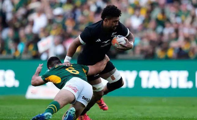 New Zealand's captain Ardie Savea, right, is challenged by South Africa's Paul de Villiers during a Test rugby match between South Africa and New Zealand, in Johannesburg, South Africa, Saturday, Aug. 22, 2026. (AP Photo/Themba Hadebe)