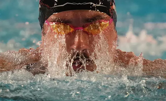 Van Mathias, of the United States, competes in the 100 meters breaststroke at the Pan Pacific Swimming Championships Thursday, Aug. 13, 2026 in Irvine, Calif. (AP Photo/Gregory Bull)