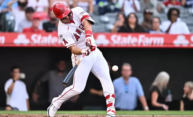 Los Angeles Angels' Mike Trout hits a home run during the first inning of a baseball game against the Texas Rangers, Monday, Aug. 10, 2026, in Anaheim, Calif. (AP Photo/William Liang)