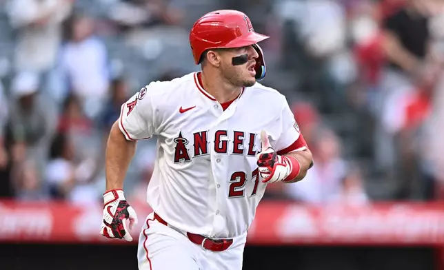 Los Angeles Angels' Mike Trout runs after hitting a home run during the first inning of a baseball game against the Texas Rangers, Monday, Aug. 10, 2026, in Anaheim, Calif. (AP Photo/William Liang)