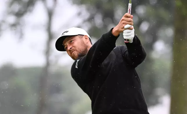 Xander Schauffele hits from the fifth tee during the final round of the Rocket Classic golf tournament, Sunday, Aug. 2, 2026, in Detroit. (AP Photo/Jose Juarez)
