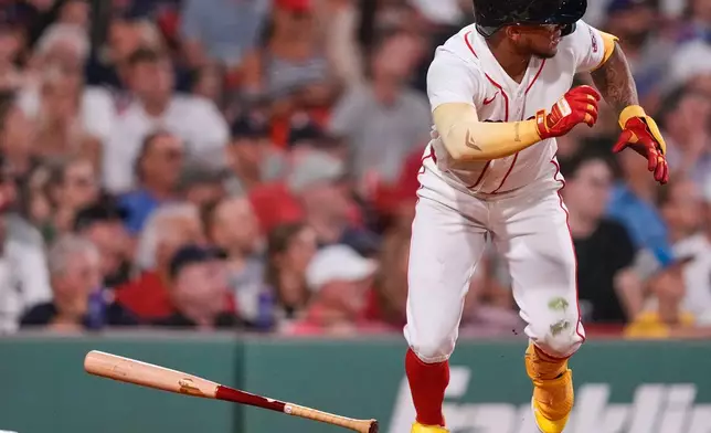 Boston Red Sox's Ceddanne Rafaela dashes down the first base line on his two RBI double during the sixth inning of a baseball game against the Chicago White Sox, Tuesday, Aug. 4, 2026, in Boston. (AP Photo/Charles Krupa)