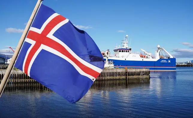 An Icelandic flag waves in the wind at Reykjavik Harbor in Reykjavik, Iceland, Sunday, Aug. 9, 2026. (AP Photo/James Brooks)