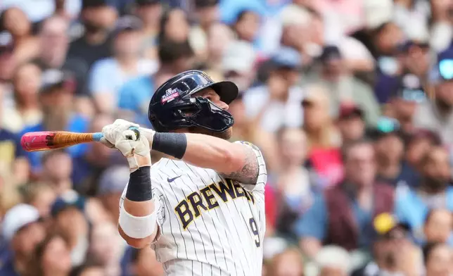 Milwaukee Brewers' Jake Bauers hits a two-run home run during the third inning of a baseball game against the Atlanta Braves, Saturday, Aug. 22, 2026, in Milwaukee. (AP Photo/Aaron Gash)