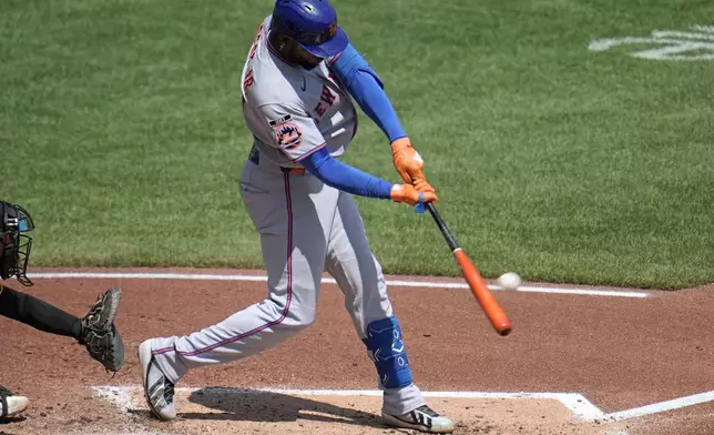 New York Mets' Luis Robert Jr. hits a two-run home run off Pittsburgh Pirates pitcher Jared Jones during the third inning of a baseball game in Pittsburgh, Sunday, Aug. 9, 2026. (AP Photo/Gene J. Puskar)