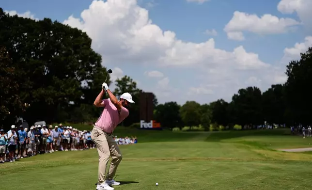 Scottie Scheffler hits on the ninth hole during the second round of the St. Jude Championship golf tournament Friday, Aug. 14, 2026, in Memphis, Tenn. (AP Photo/George Walker IV)