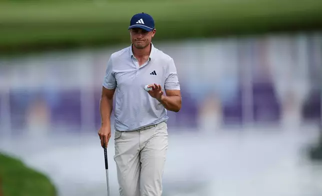 Ludvig Aberg, of Sweden, after putting in on the 18th hole during the second round of the St. Jude Championship golf tournament Friday, Aug. 14, 2026, in Memphis, Tenn. (AP Photo/George Walker IV)