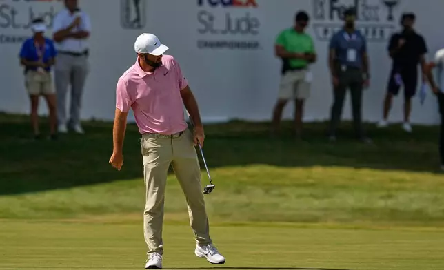 Scottie Scheffler misses a birdie try on the 18th hole during the second round of the St. Jude Championship golf tournament Friday, Aug. 14, 2026, in Memphis, Tenn. (AP Photo/George Walker IV)