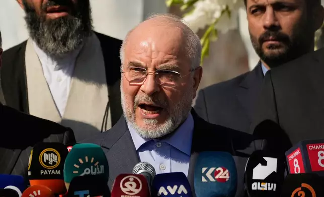 Iranian Parliament Speaker Mohammad Baqer Qalibaf addresses attendees at the site near Baghdad International Airport where Iranian military commander Qassem Soleimani was killed in a U.S. drone strike, in Baghdad, Iraq, Wednesday, Aug. 19, 2026.(AP Photo/Hadi Mizban)
