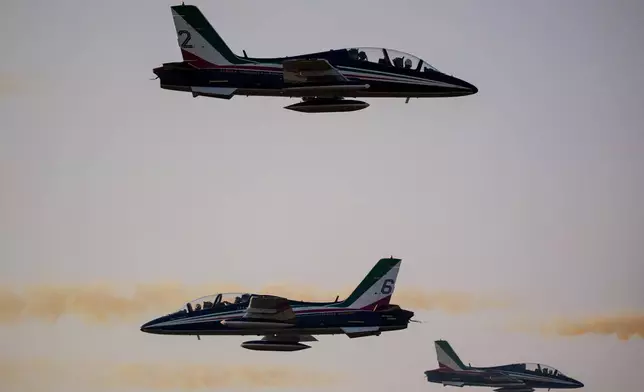 Frecce Tricolori, the aerobatic demonstration team of the Italian Air Force, perform on the first day of the BIAS International Air Show, in Bucharest, Romania, Friday, Aug. 28, 2026. (AP Photo/Andreea Alexandru)