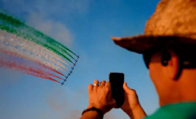 Frecce Tricolori, the aerobatic demonstration team of the Italian Air Force, performs at the BIAS International Air Show, in Bucharest, Romania, Saturday, Aug. 29, 2026. (AP Photo/Andreea Alexandru)