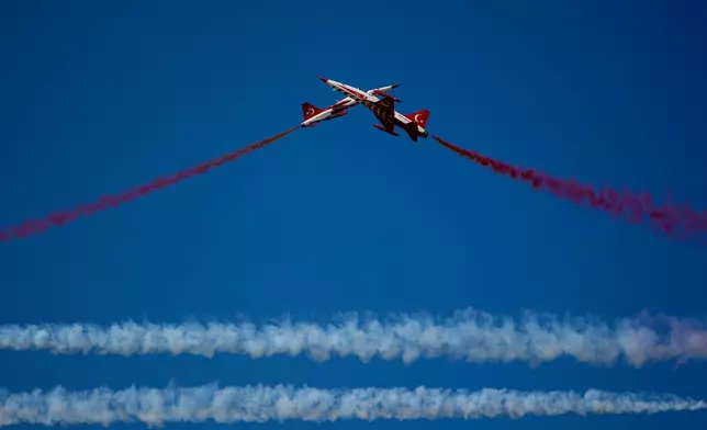 Turkish Stars, the aerobatic demonstration team of the Turkish Air Force, perform at the BIAS International Air Show, in Bucharest, Romania, Saturday, Aug. 29, 2026. (AP Photo/Andreea Alexandru)