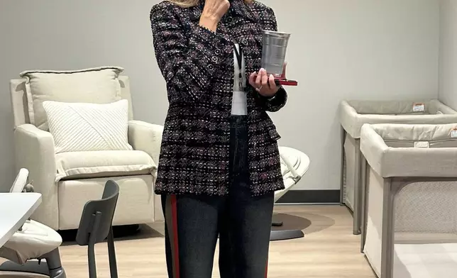 Lisa Bhathal Merage, one of the owners of the NWSL’s Portland Thorns and the WNBA’s Portland Fire, shows off the nursery in the new joint training facility for the teams in Hillsboro, Ore., Friday, Aug. 21, 2026. (AP Photo/Anne M. Peterson)