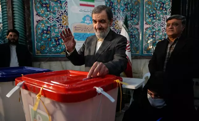 FILE - Former Revolutionary Guard commander Mohsen Rezaei casts his ballot during the parliamentary and Assembly of Experts elections at a polling station in Tehran, Iran, March 1, 2024. (AP Photo/Vahid Salemi, File)