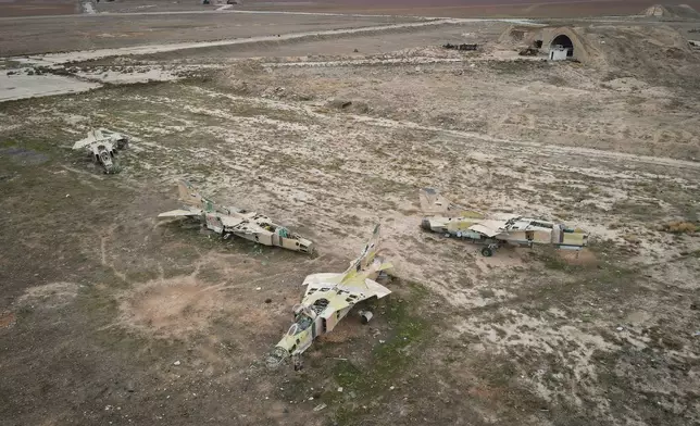 FILE - Decommissioned Syrian air force planes are seen at the Abu Duhur military air base east of Idlib, following the takeover of the area by Syrian opposition fighters on Saturday, Dec. 7, 2024. (AP Photo/Omar Albam, File)