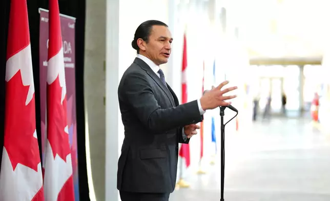 FILE - Manitoba Premier Wab Kinew talks to media as he arrives for a first ministers meeting in Ottawa on Jan.15, 2025. (Sean Kilpatrick/The Canadian Press via AP, File)