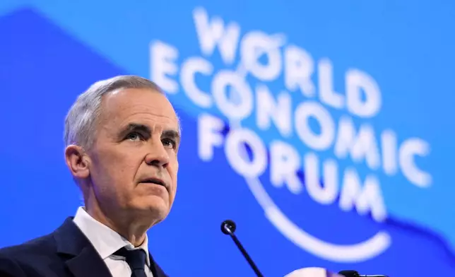 FILE - Canada's Prime Minister Mark Carney speaks during the Annual Meeting of the World Economic Forum in Davos, Switzerland, Jan. 20, 2026. (AP Photo/Markus Schreiber, File)