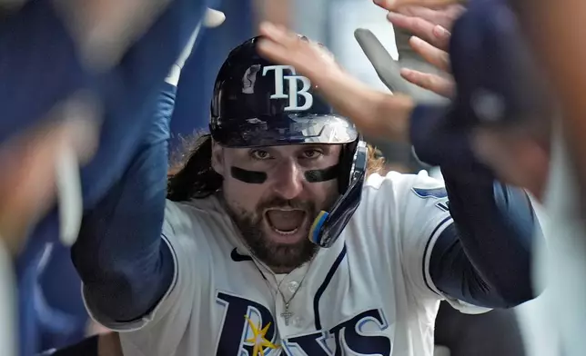 Tampa Bay Rays' Ryan Vilade celebrates in the dugout after his home run off Baltimore Orioles pitcher Brandon Young during the fourth inning of a baseball game Monday, Aug. 17, 2026, in St. Petersburg, Fla. (AP Photo/Chris O'Meara)