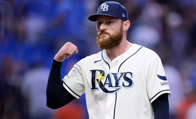 Tampa Bay Rays pitcher Bryan Baker pumps his fist after closing out the Baltimore Orioles during the ninth inning of a baseball game Monday, Aug. 17, 2026, in St. Petersburg, Fla. (AP Photo/Chris O'Meara)