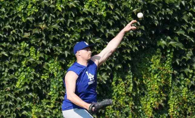 Los Angeles Dodgers pitcher Tarik Skubal warms up before a baseball game against the Chicago Cubs, Monday, Aug. 3, 2026, in Chicago. (AP Photo/David Banks)