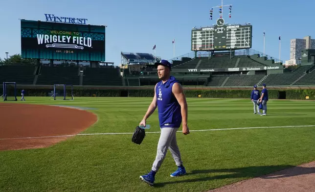 Los Angeles Dodgers pitcher Tarik Skubal walks to the dugout after warming up before a baseball game against the Chicago Cubs Monday, Aug. 3, 2026, in Chicago. (AP Photo/David Banks)