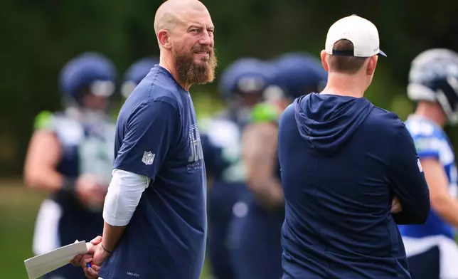 Seattle Seahawks offensive coordinator Brian Fleury looks on during the NFL football team's training camp, Saturday, July 25, 2026, in Renton, Wash. (AP Photo/Lindsey Wasson)