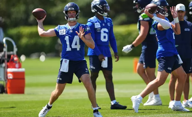 Seattle Seahawks quarterback Sam Darnold throws during the NFL football team's training camp, Saturday, Aug. 1, 2026, in Renton, Wash. (AP Photo/Lindsey Wasson)