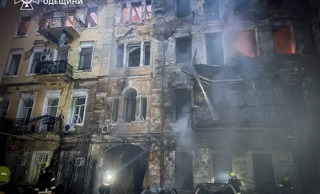 In this photo provided by the Ukrainian Emergency Service, emergency services personnel work to extinguish a fire of residential buildings following a Russian missiles attack in Odesa, Ukraine, Sunday, Aug. 9, 2026. (Ukrainian Emergency Service via AP)
