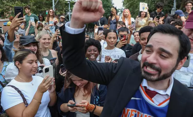 Amadeo Fusca, winner of the Zohran Mamdani look-alike contest, reacts with the crowd, Sunday, Aug. 30, 2026, in New York. (AP Photo/Heather Khalifa)