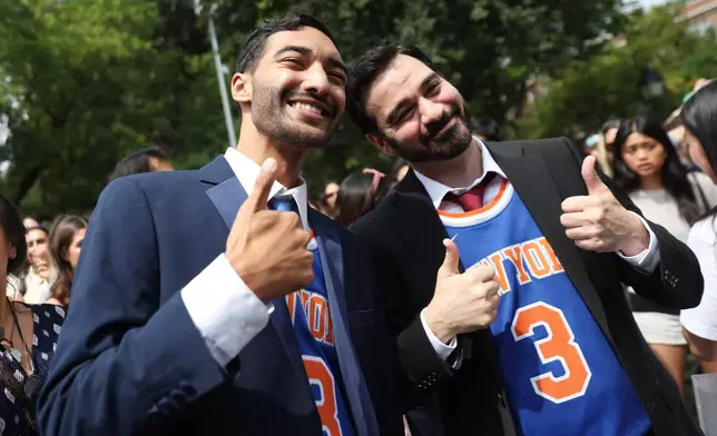 Participants pose for photos during a Zohran Mamdani look-alike contest, Sunday, Aug. 30, 2026, in New York. (AP Photo/Heather Khalifa)