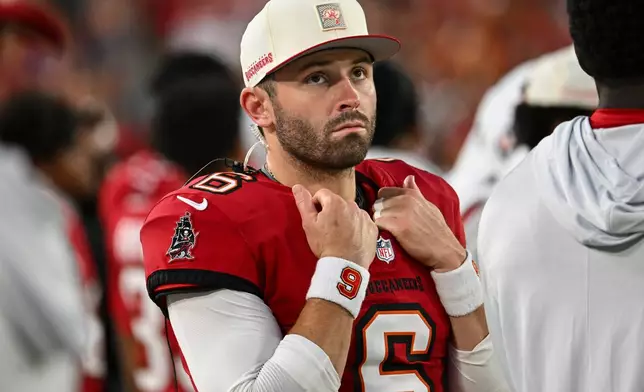 Tampa Bay Buccaneers quarterback Baker Mayfield (6) watches play against the Kansas City Chiefs in the first half an NFL football game, Saturday, Aug. 22, 2026, in Tampa, Fla. (AP Photo/Mark LoMoglio)