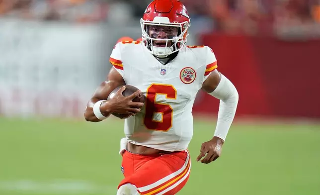 Kansas City Chiefs quarterback Justin Fields (6) runs in the first half of an NFL preseason football game against the Tampa Bay Buccaneers, Saturday, Aug. 22, 2026, in Tampa, Fla. (AP Photo/Chris O'Meara)