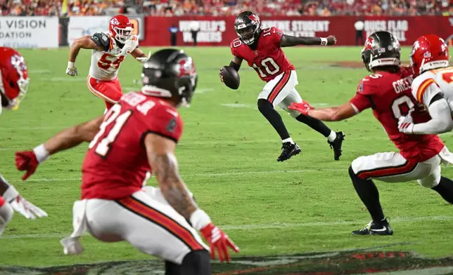 Tampa Bay Buccaneers' Jalon Daniels (10) runs against the Kansas City Chiefs in the second half of an NFL preseason football game, Saturday, Aug. 22, 2026, in Tampa, Fla. (AP Photo/Mark LoMoglio)