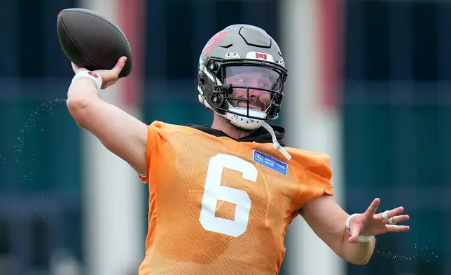 Tampa Bay Buccaneers quarterback Baker Mayfield throws a pass during an NFL football training camp practice Thursday, July 30, 2026, in Tampa, Fla. (AP Photo/Chris O'Meara)