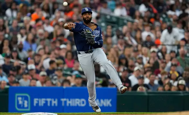 Tampa Bay Rays third baseman Junior Caminero throws for an out on a Detroit Tigers' Dillon Dingler ground ball during the fifth inning of a baseball game Tuesday, Aug. 25, 2026, in Detroit. (AP Photo/Paul Sancya)