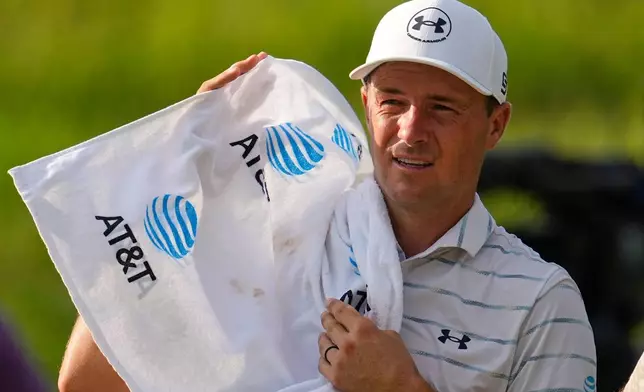 Jordan Spieth uses a towel to wipe his face during the first round of the St. Jude Championship golf tournament Thursday, Aug. 13, 2026, in Memphis, Tenn. (AP Photo/George Walker IV)