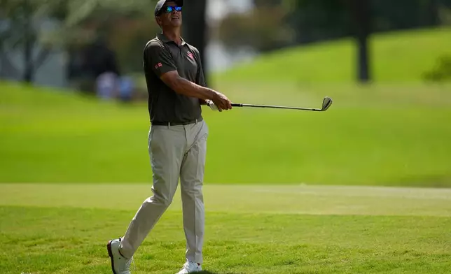 Adam Scott, of Australia, follows his ball to the nineth green during the first round of the St. Jude Championship golf tournament, Thursday, Aug. 13, 2026, in Memphis, Tenn. (AP Photo/George Walker IV)