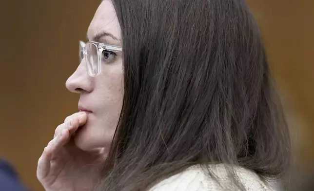 Defendant Lindsay Clancy listens to forensic psychologist Dr. Kirk Heilbrun testify about the voices she says she heard before she strangled her three children during her murder trial at Plymouth Superior Court, Monday, Aug. 24, 2026 in Plymouth, Mass. (Greg Derr/The Patriot Ledger via AP, Pool)