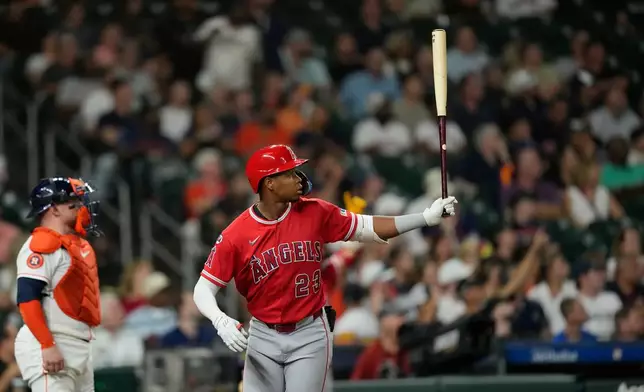 Los Angeles Angels' Denzer Guzman watches his two-run double, on fan interference, during the fourth inning of a baseball game against the Houston Astros Wednesday, Aug. 19, 2026, in Houston. (AP Photo/David J. Phillip)