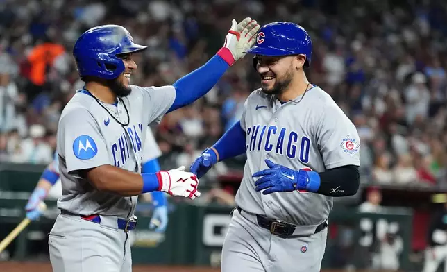 Chicago Cubs' Michael Conforto, right, celebrates his two-run home run against the Arizona Diamondbacks with Cubs' Pedro Ramírez during the sixth inning of a baseball game, Monday, Aug. 24, 2026, in Phoenix. (AP Photo/Ross D. Franklin)