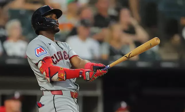Cleveland Guardians' Angel Martínez watches his grand slam during the fifth inning of a baseball game against the Chicago White Sox, Friday, Aug. 7, 2026, in Chicago. (AP Photo/Melissa Tamez)