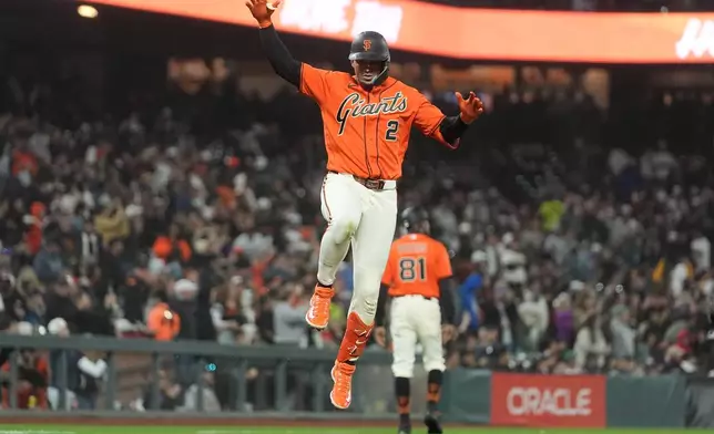 San Francisco Giants' Willy Adames (2) celebrates after hitting a home run against the Detroit Tigers during the fifth inning of a baseball game, Friday, Aug. 7, 2026, in San Francisco. (AP Photo/Jeff Chiu)