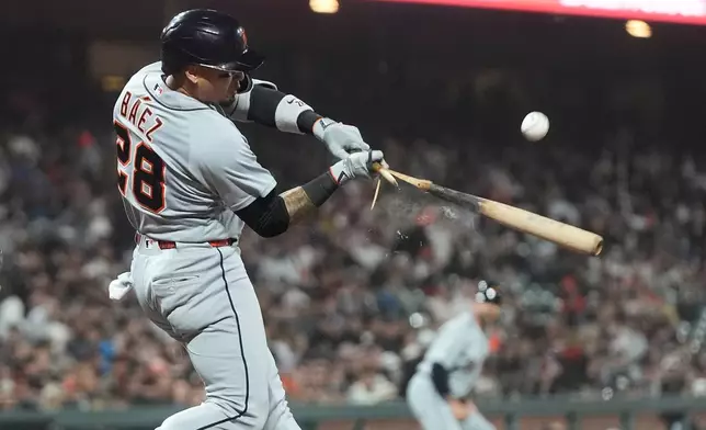 Detroit Tigers' Javier Báez breaks his bat while flying out during the sixth inning of a baseball game against the San Francisco Giants, Friday, Aug. 7, 2026, in San Francisco. (AP Photo/Jeff Chiu)