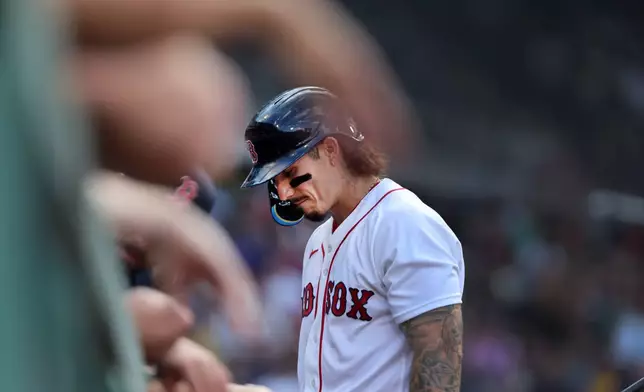 Boston Red Sox's Jarren Duran walks into the dugout after striking out in the fourth inning of a baseball game against the Athletics, Saturday, Aug. 8, 2026, in Boston. (AP Photo/Jim Davis)