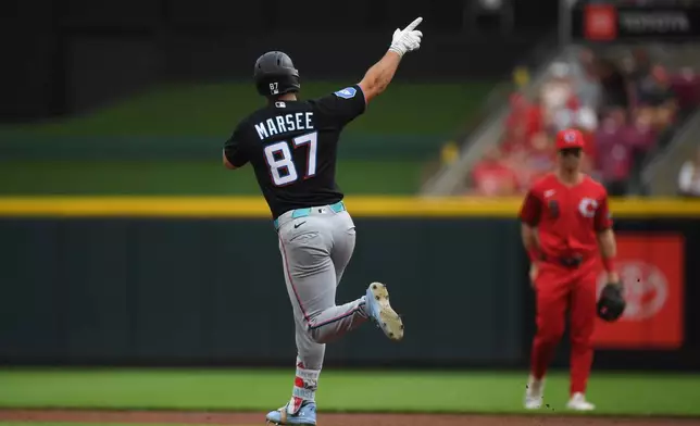 Miami Marlins' Jakob Marsee celebrates as he rounds the bases after a solo home run during the third inning of a baseball game against the Cincinnati Reds on Saturday, Aug. 15, 2026 in Cincinnati. (AP Photo/Tanner Pearson)