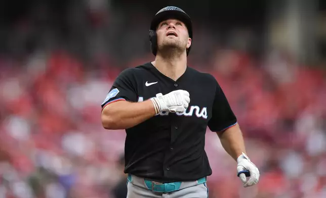 Miami Marlins' Jakob Marsee (87) celebrates after hitting a solo home run during the third inning of a baseball game against the Cincinnati Reds on Saturday, Aug. 15, 2026 in Cincinnati. (AP Photo/Tanner Pearson)