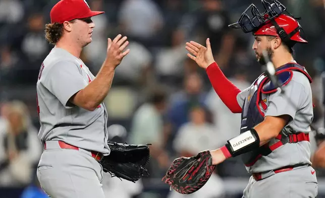 St. Louis Cardinals pitcher Gordon Graceffo, left, celebrates with catcher Jimmy Crooks after a baseball game against the New York Yankees Monday, Aug. 3, 2026, in New York. (AP Photo/Frank Franklin II)