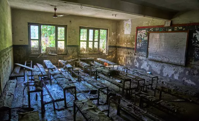 Mud covers the floor of a classroom damaged in the recent flash floods at the Shree Bagheswori Madhyamik School in Galchhi, Dhading district of Nepal Sunday, Aug. 30, 2026. (AP Photo/Niranjan Shrestha)